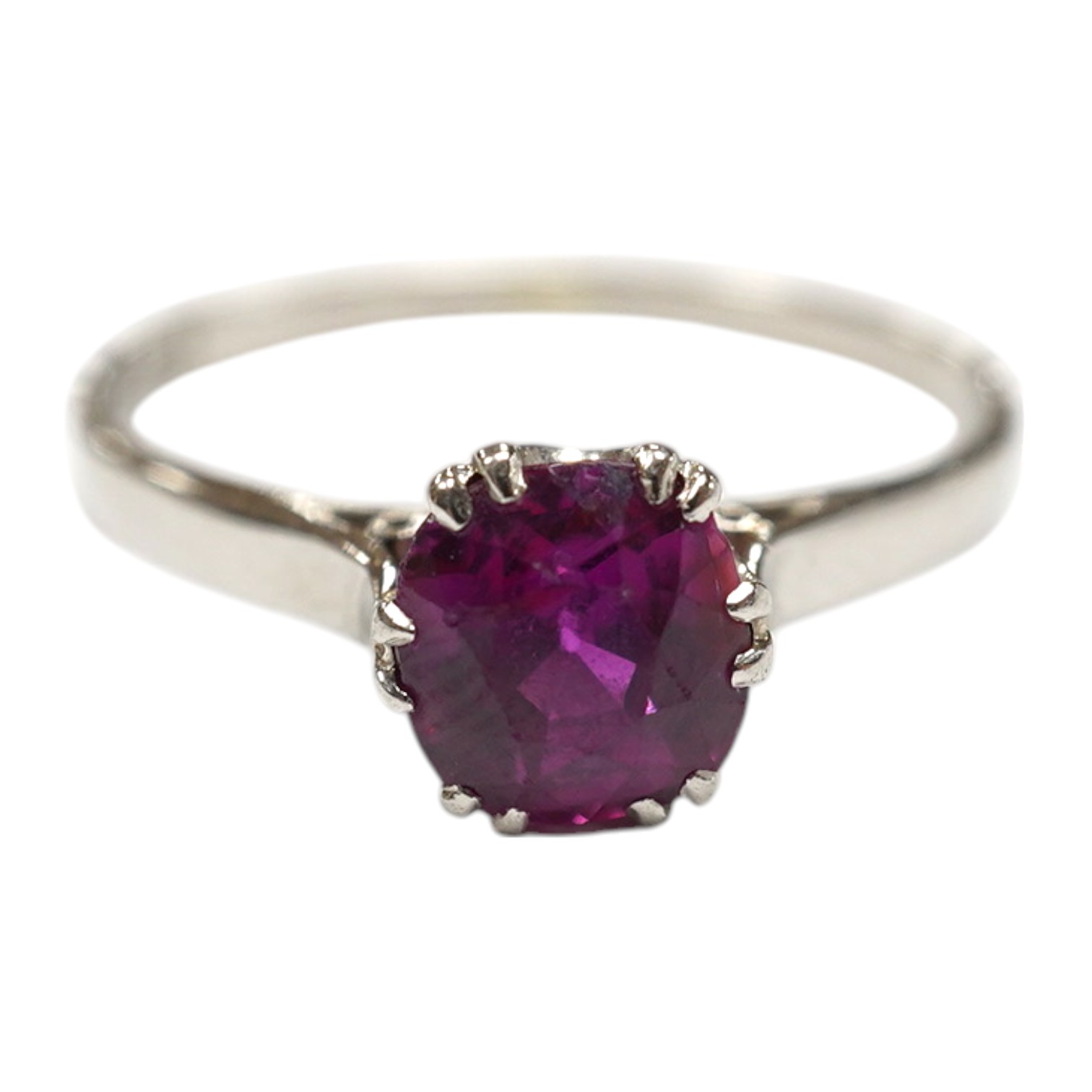 A white metal (stamped plat) and solitaire ruby set ring, size L, gross weight 2.2 grams. Condition - poor to fair